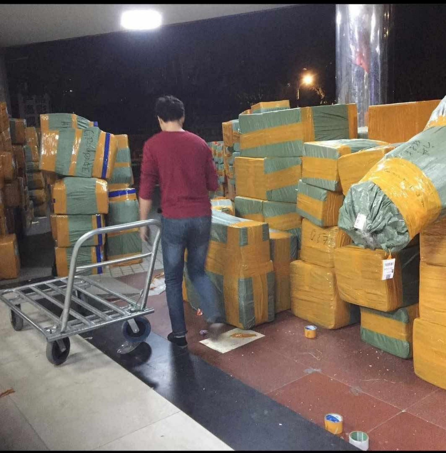 Parcels and a trolley in a cargo handling area